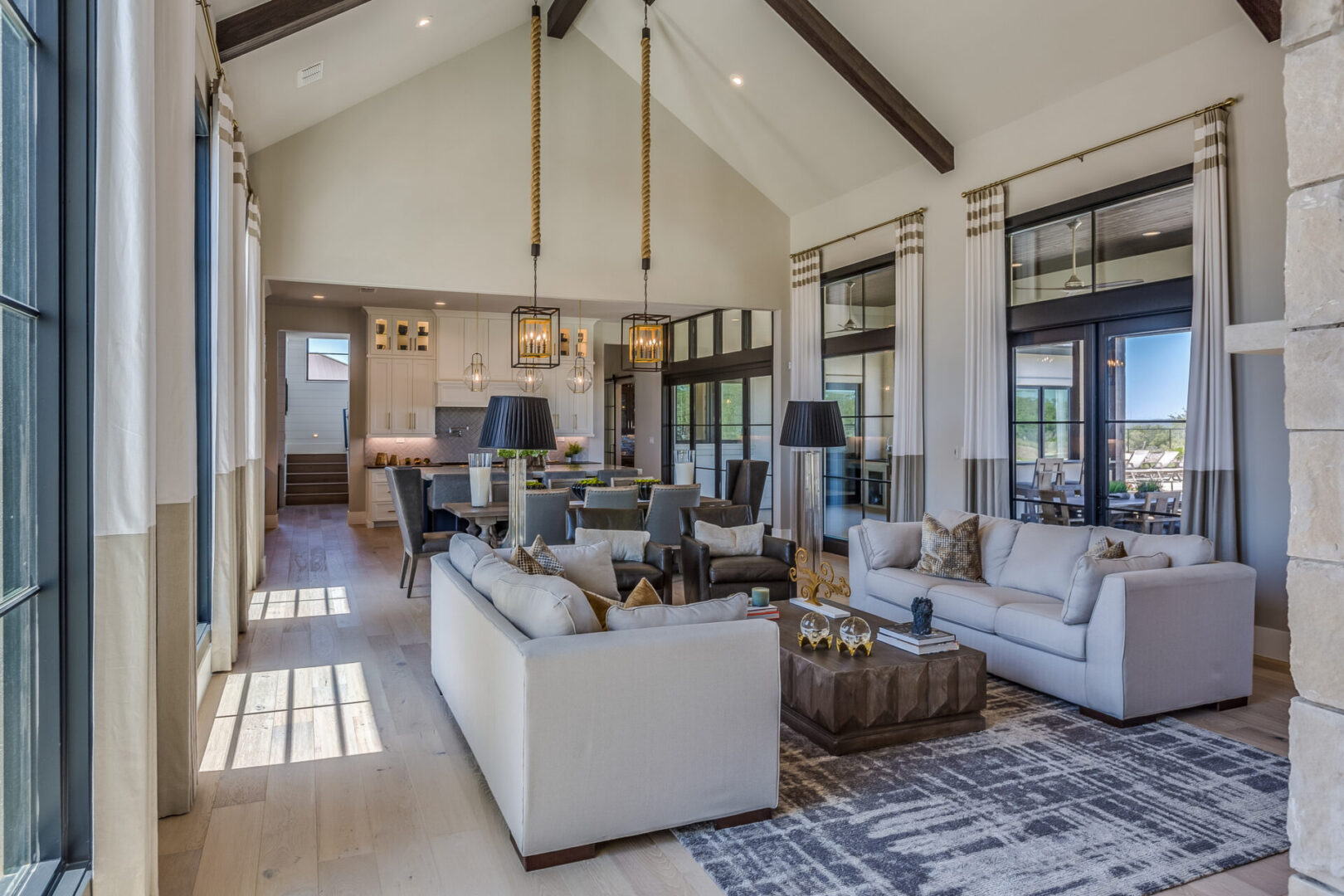 Spacious modern living room with large windows.